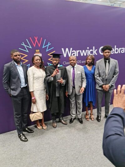 Family members posed for photograph at a graduation ceremony