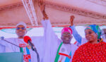 Buhari Raises Tinubu's Hand