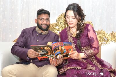 The couple reading latest published Excel Magazine 