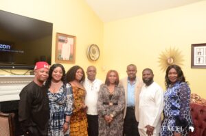 CEO of Excel Global Media in a group picture with the celebrant's parents and other well-wishers 